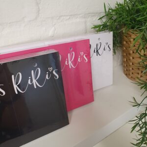 RiRis clothing tags printed in black, pink and white
